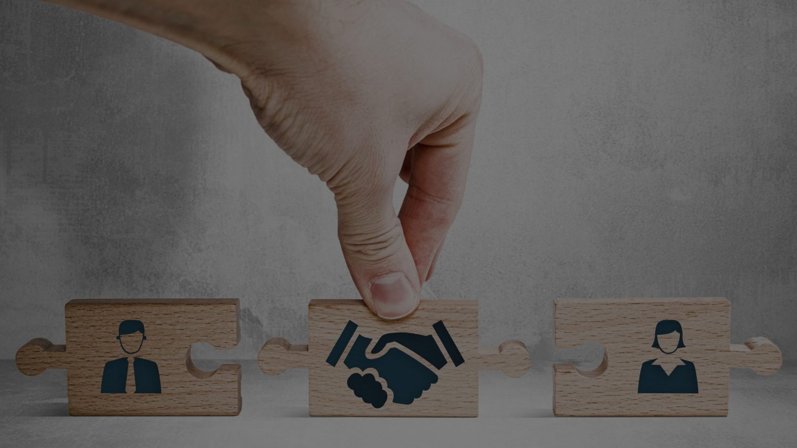 Three blocks showing two people and shaking hands