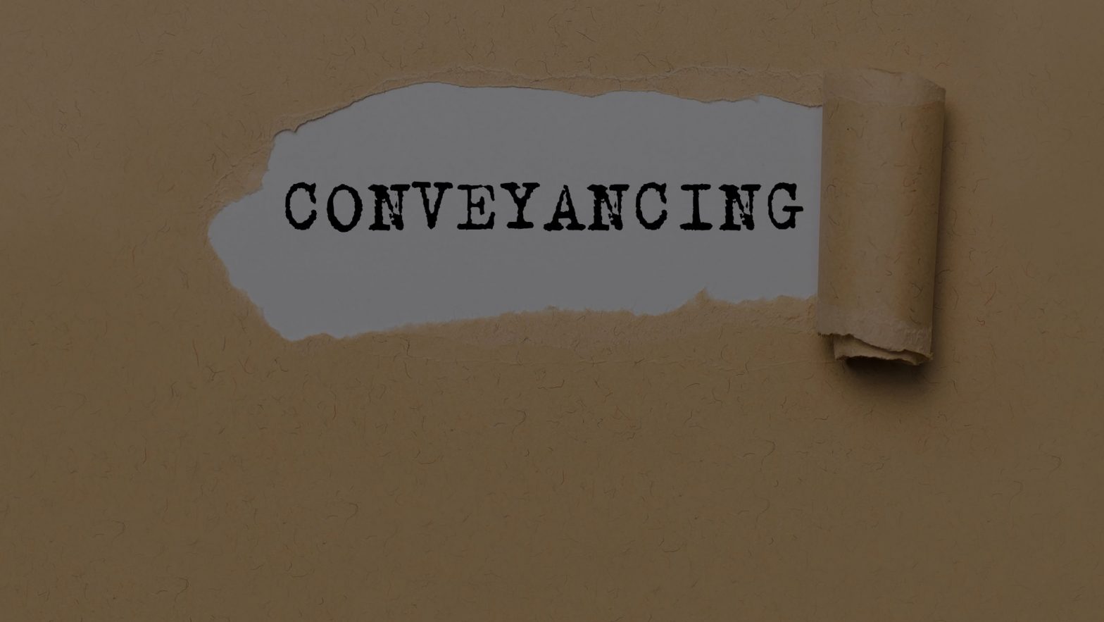 Ripped paper showing "conveyancing"