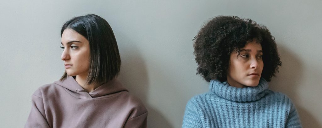 Two upset people facing away from each other