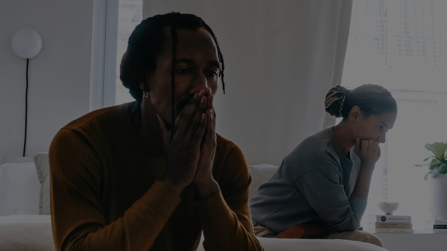 Stressed man wth head in his hands