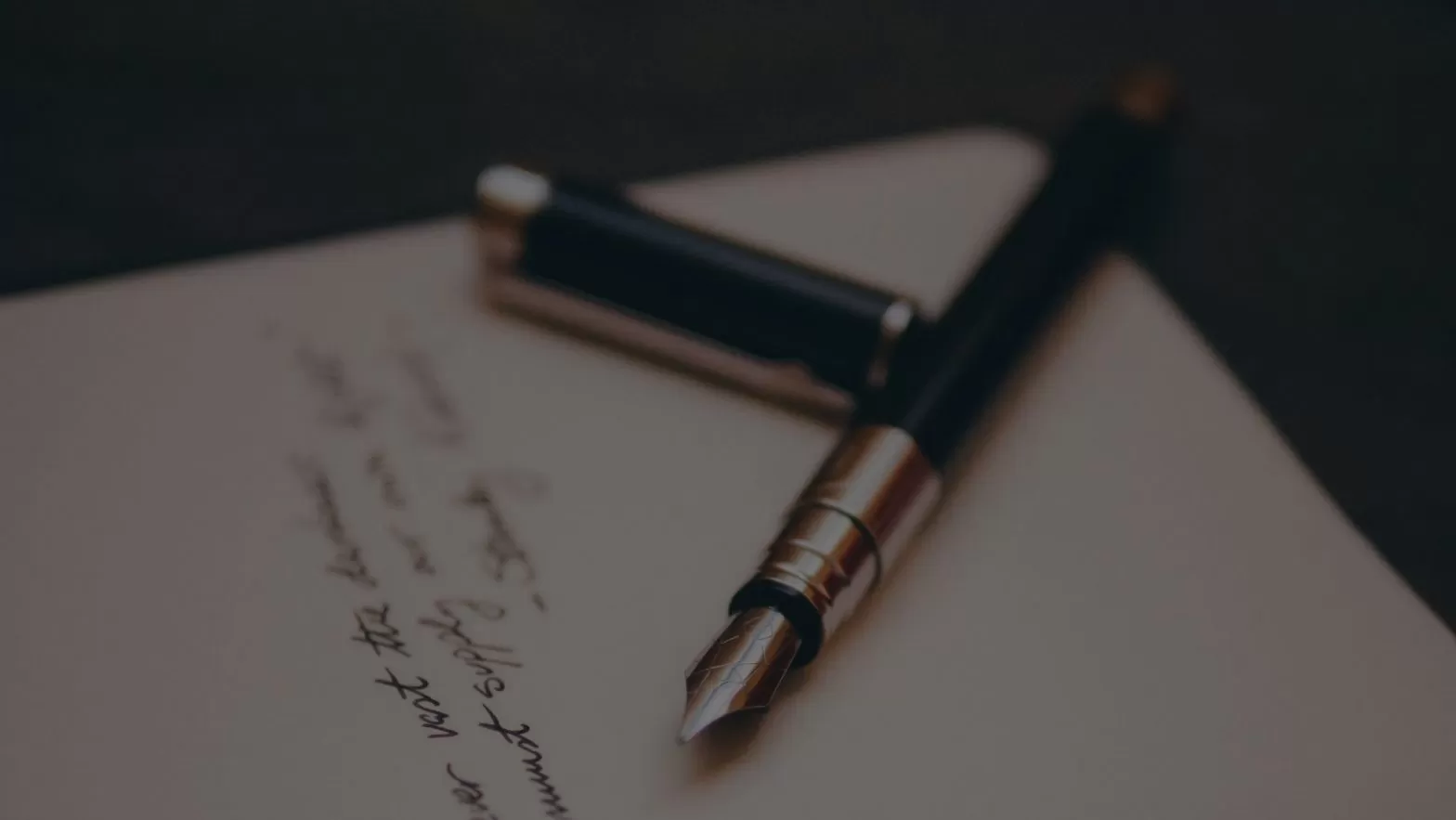 Fountain pen sitting on paper